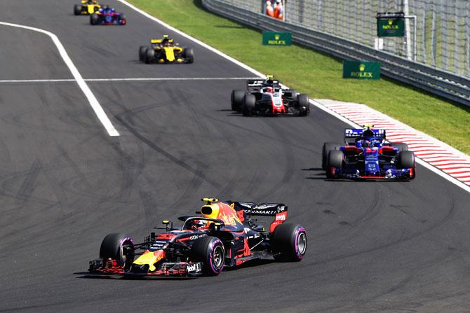 Max Verstappen of the Netherlands driving the (33) Aston Martin Red Bull Racing RB14 TAG Heuer leads Pierre Gasly of France and Scuderia Toro Rosso driving the (10) Scuderia Toro Rosso STR13 Honda on track during the Formula One Grand Prix of Hungary on Sunday