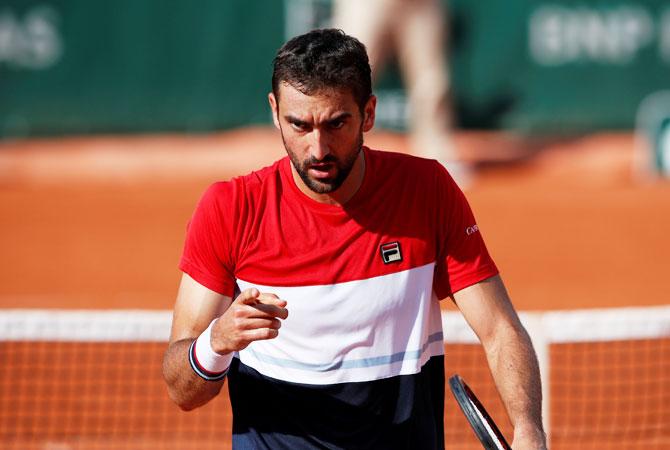 Croatia's Marin Cilic reacts during his third round match against USA's Steve Johnson