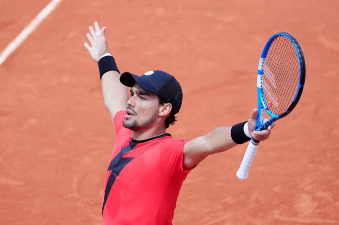 Italy's Fabio Fognini celebrates after winning his third round match against Britain's Kyle Edmund