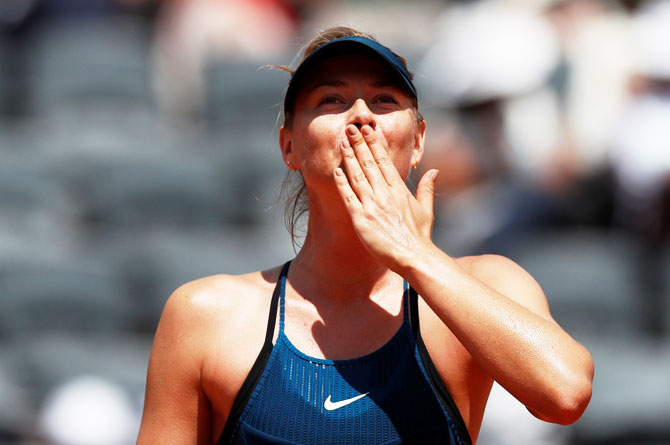 Russia's Maria Sharapova celebrates after winning her third round match against Czech Republic's Karolina Pliskova 