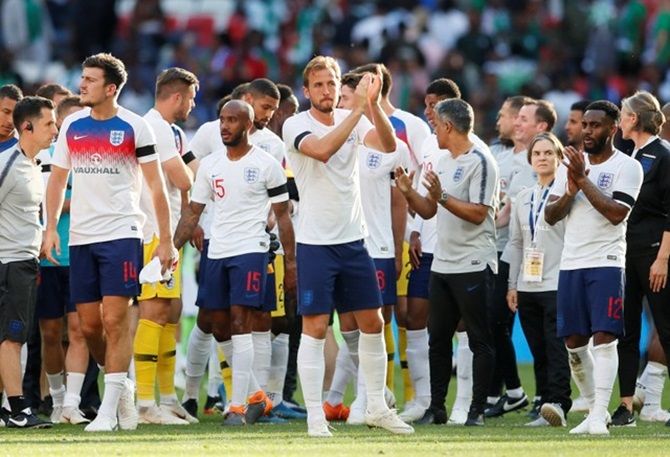 ngland's Harry Kane and team mates applaud fans after the match