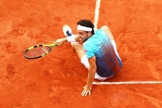 Italy's Marco Cecchinato celebrates his fourth round victory over Belgium's David Goffin on Sunday