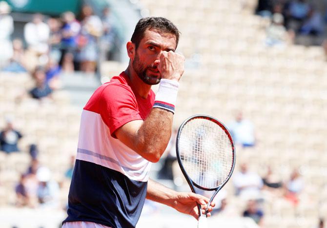 Marin Cilic pumps his fists during his match against Del Potro