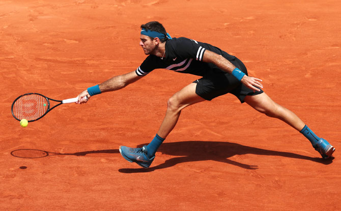 Argentina's Juan Martin del Potro plays a return against Marin Cilic