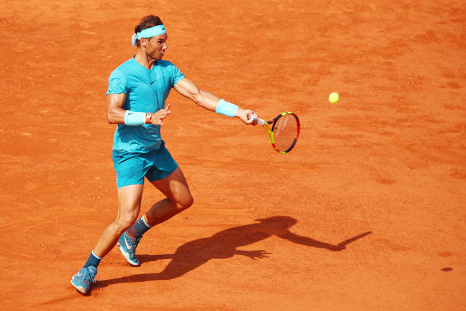 Rafael Nadal plays a forehand return against Juan Martin del Potro