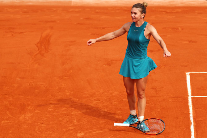 Simona Halep reacts after match point