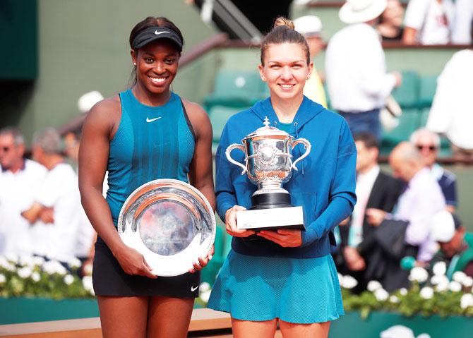 Romania’s Simona Halep and USA's Sloane Stephens pose for photographs with their trophies