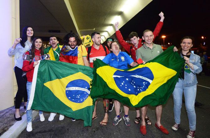 Brazil supporters greet the players on arrival in Sochi on Monday