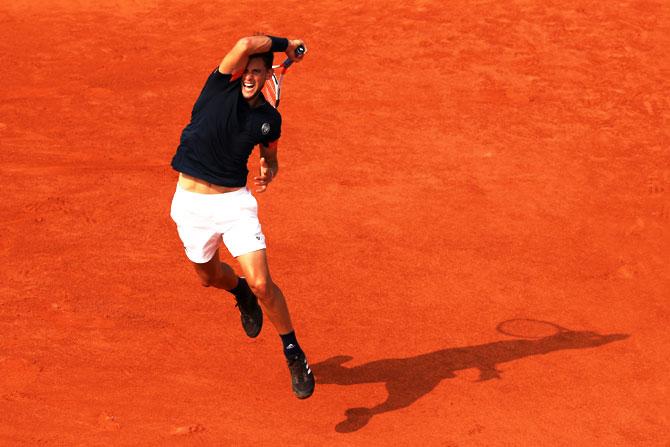 Dominic Thiem plays a forehand return