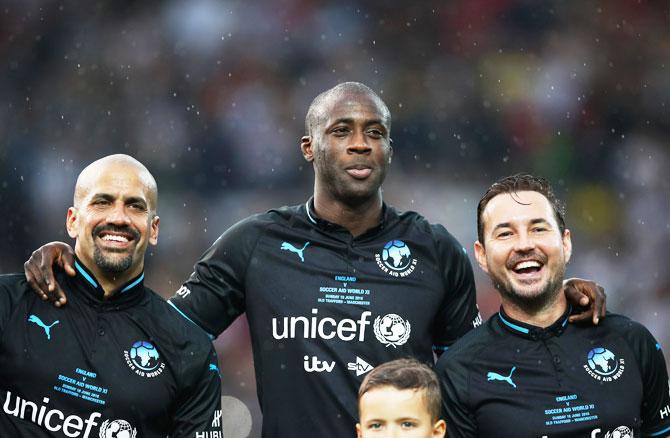 World XI's Juan Sebastian Veron, Yaya Toure and Martin Compston look on prior to the Soccer Aid for UNICEF 2018 match