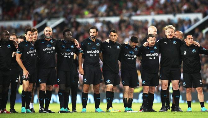 World XI players look on during the penalty shoot out 