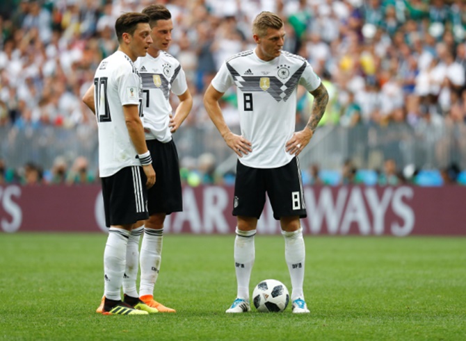  Germany's Mesut Ozil, Julian Draxler and Toni Kroos look dejected after Mexico's Hirving Lozano (not pictured) scored