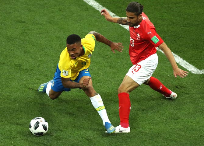  Brazil's Gabriel Jesus is challenged by Ricardo Rodriguez of Switzerland