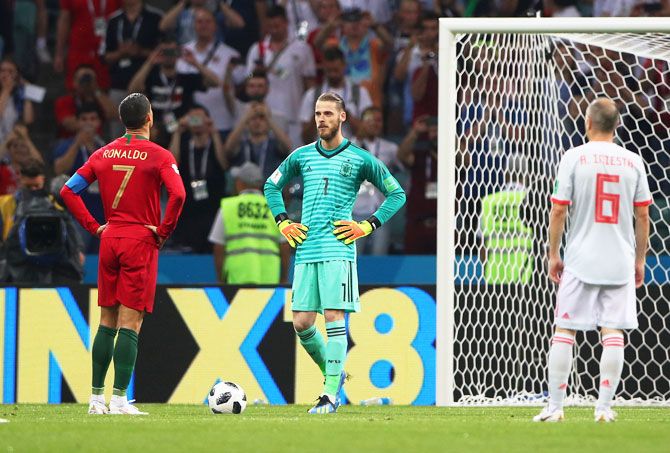 Portugal's Cristiano Ronaldo prepares to take a penalty as Spain's David De Gea looks on during their World Cup opener at Fisht Stadium in Sochi on Friday