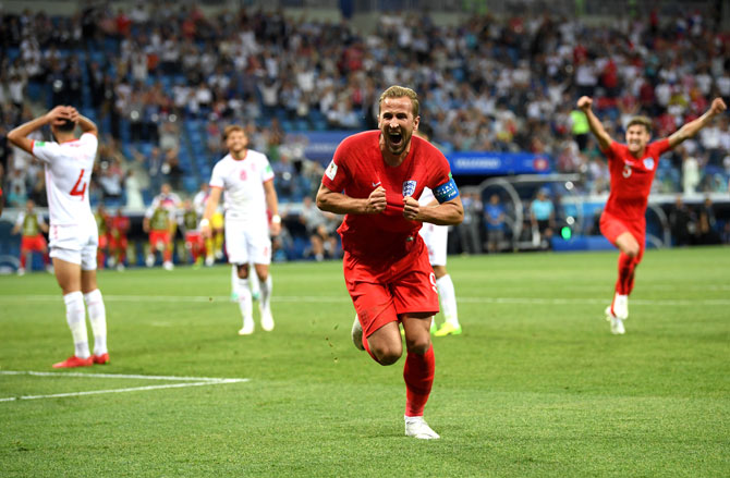 England's Captain Harry Kane celebrates after scoring the winner in the game against Tunisia. Photograph: Matthias Hangst/Getty Images