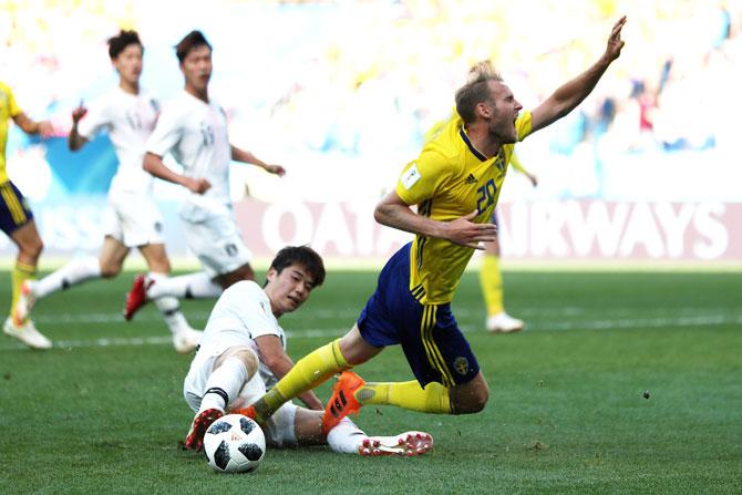 South Korea's Ki Sung-yueng challenges Sweden's Ola Toivonen