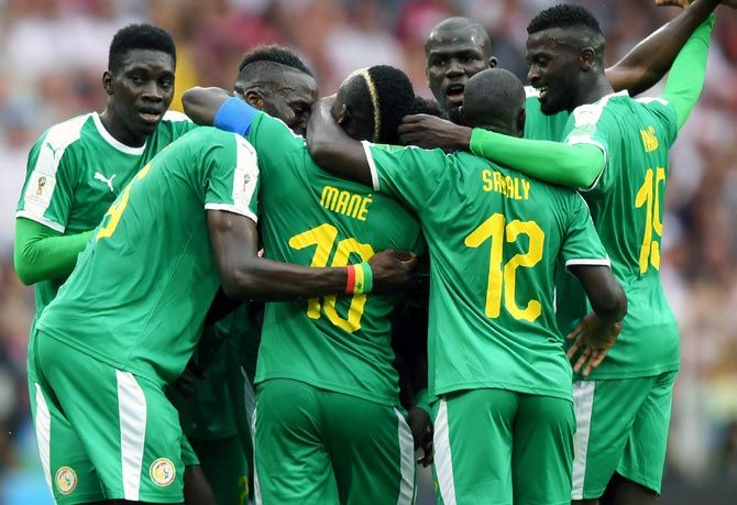 Senegal's players celebrate Thiago Cionek's own goal gave them a 1-0 lead against Poland