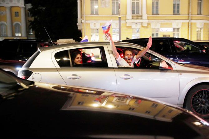 Russian fans celebrate the World Cup win over Egypt in Moscow, on Tuesday