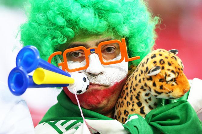 An Iran fan enjoys the pre-match atmosphere outside the Kazan Arena on Wednesday