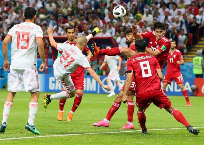 Spain’s David Silva attempts an overhead shot