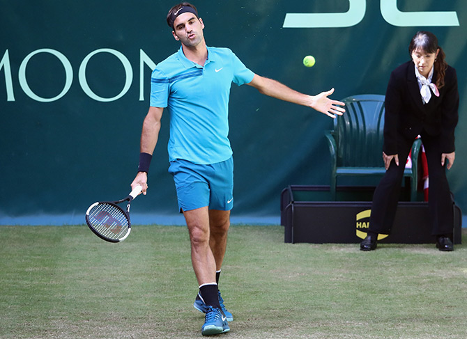 Switzerland's Roger Federer reacts during his round of 16 match against France's Benoit Paire on Day 4 of the Gerry Weber Open at Gerry Weber Stadium in Halle, Germany, on Friday