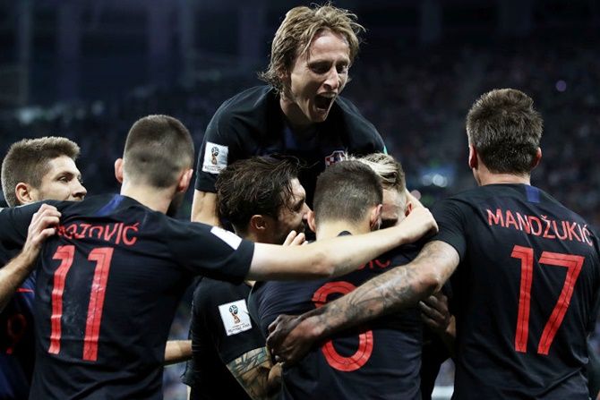 Croatia’s Luka Modric celebrates with teammates after beating Argentina
