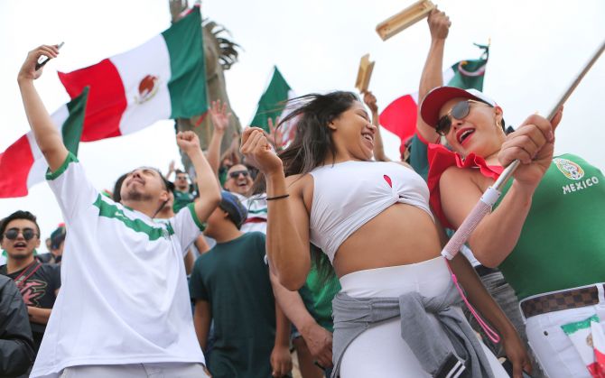 Mexico fans celebrate after their 2-1 victory over South Korea during the World Cup in Tijuana, Mexico, on Saturday