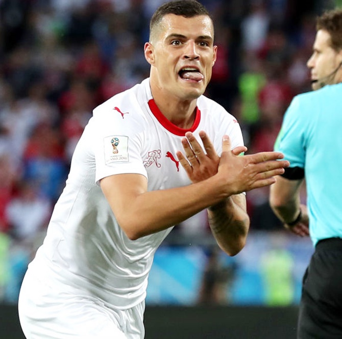 Granit Xhaka of Switzerland celebrates after scoring against Serbia