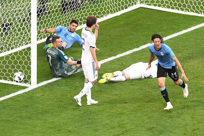 Uruguay's Edinson Cavani celebrates after scoring his team's third goal