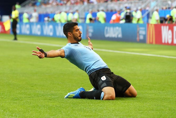 Uruguay's Luis Suarez celebrates after scoring his team's first goal against Russia