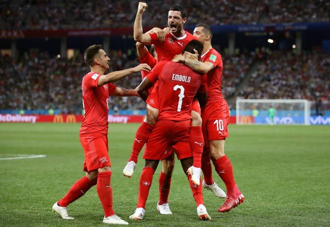 Switzerland's players celebrate after Blerim Dzemaili scores the opening goal against Costa Rica