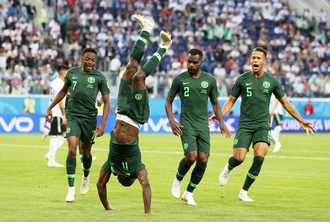 Nigeria's Victor Moses celebrates with teammates after scoring his team's first goal against Argentina during their Group D match
