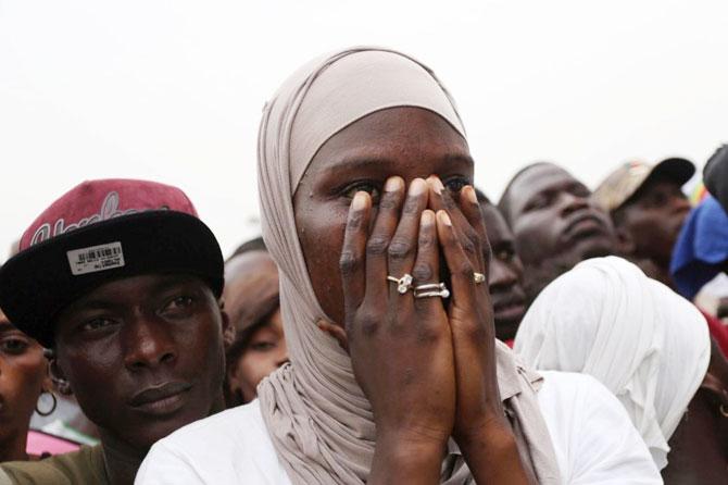 A Senegal fan wears a shocked reaction after the match against Colombia on Thursday