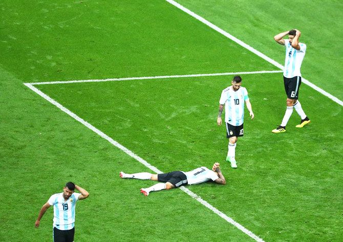 Argentina's Lionel Messi, Nicolas Otamendi, Sergio Aguero and Federico Fazio look dejected at the end of the match