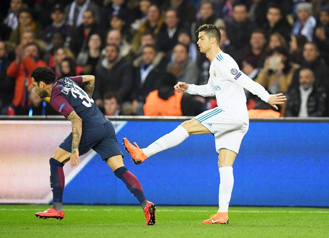 Real Madrid's Cristiano Ronaldo aims a kick at PSG's Dani Alves