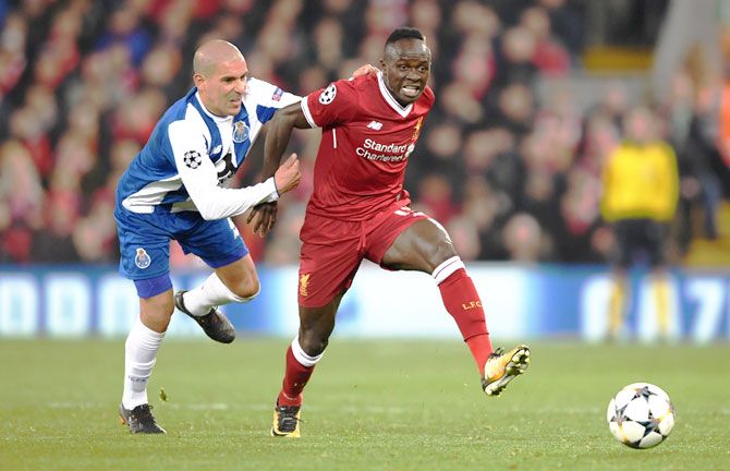 Liverpool's Sadio Mane is challenged by FC Porto's Maximiliano during the UEFA Champions League Round of 16 Second Leg match at Anfield in Liverpool