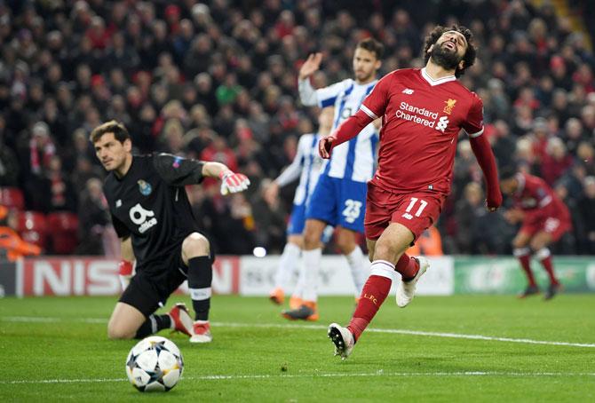 Liverpool's Mohamed Salah reacts after missing a scoring opportunity