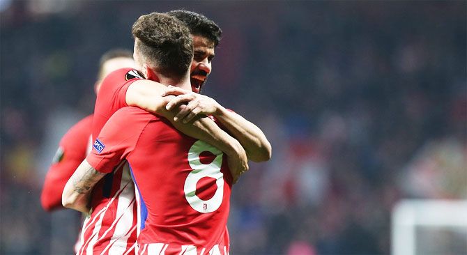 Atletico Madrid's Diego Costa celebrates after scoring against Lokomotiv Moscow at the Wanda Metropolitano stadium in Madrid