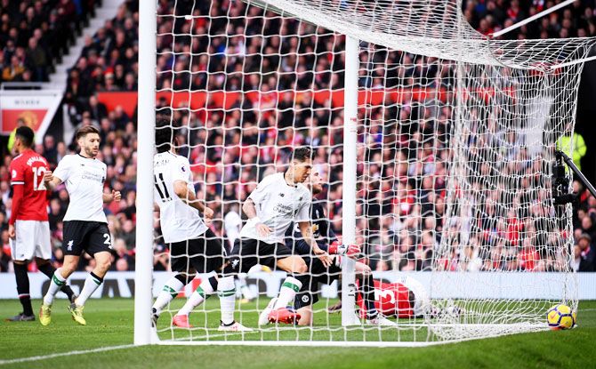 Manchester United's Eric Bailly scores an own goal