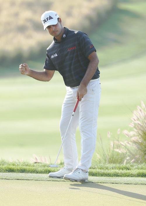 India's Shubhankar Sharma celebrates a putt on the 16th green during day three of the Hero Indian Open at Dlf Golf and Country Club in New Delhi on Sunday