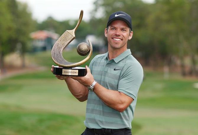 Paul Casey poses with the trophy after winning the Valspar Championship golf tournament at Innisbrook Resort, Copperhead Course in Palm Harbor, Florida on Monday