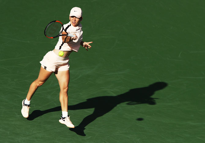 Romania's Simona Halep hits a shot during her match against USA's Caroline Dolehide