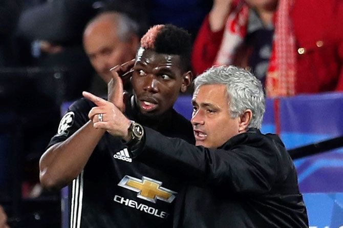 Manchester United manager Jose Mourinho speaks with Paul Pogba