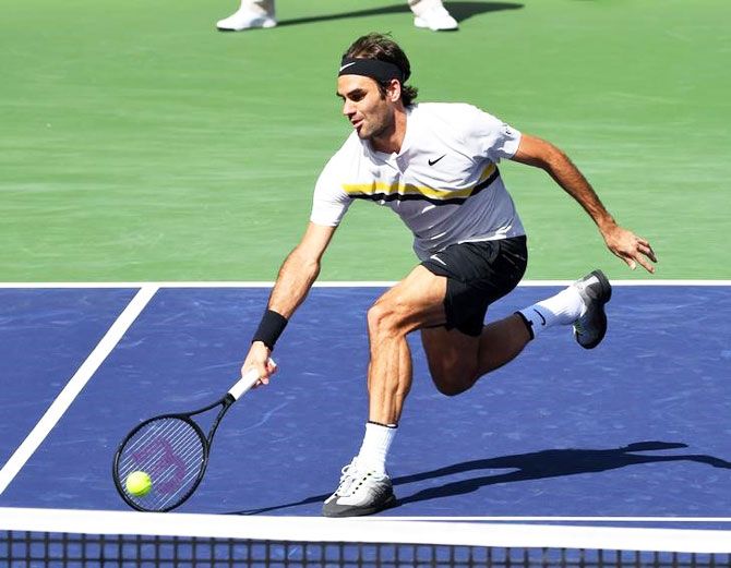 Roger Federer plays a return during his third round match against Filip Krajinovic at the Indian Wells Tennis Garden at Indian Wells in California