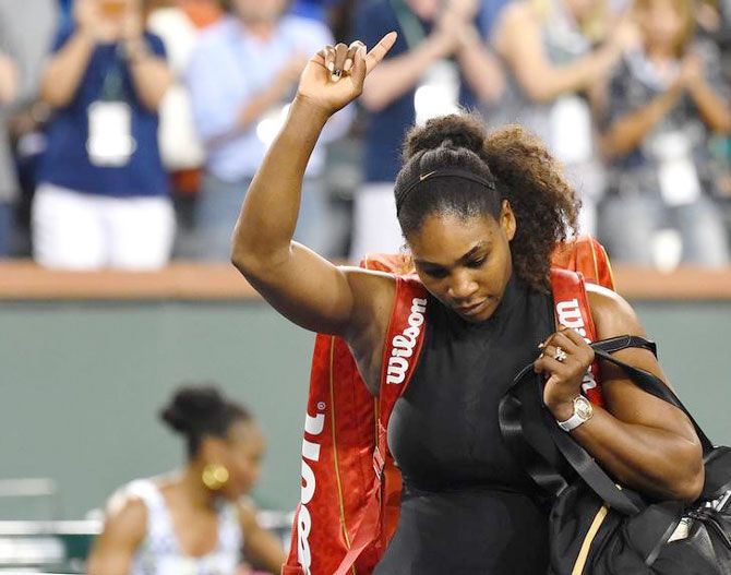  Serena Williams leaves the court after her defeat to sister Venus Williams in the third round match of the BNP Paribas Open at Indian Wells on March 13