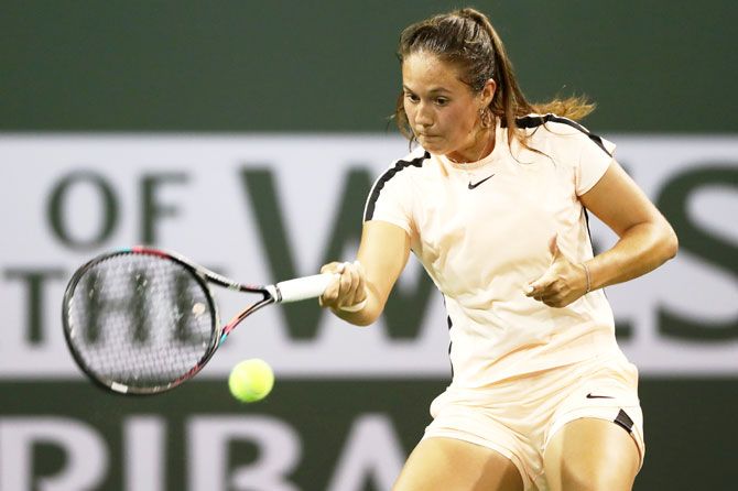 Russia's Daria Kasatkina returns a shot against Denmark's Caroline Wozniacki