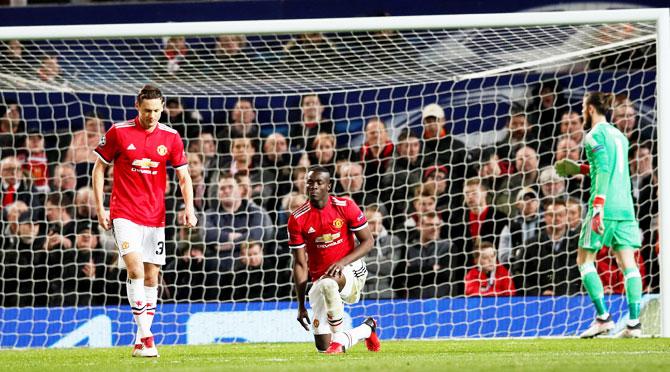 Manchester United's Nemanja Matic and Eric Bailly look dejected after Sevilla’s Wissam Ben Yedder scored their opening goal during their Champions League match at Old Trafford on Tuesday