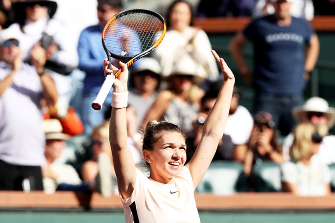 Romania's Simona Halep celebrates her win against Croatia's Petra Martic