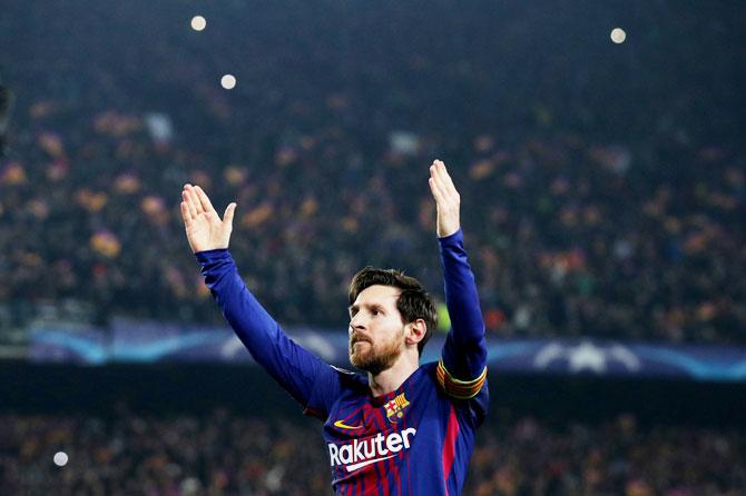 Barcelona’s Lionel Messi celebrates scoring their third goal