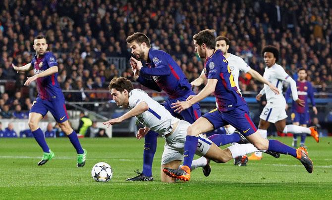 Chelsea's Marcos Alonso is challenged by Barcelona’s Gerard Pique and Sergi Roberto Action